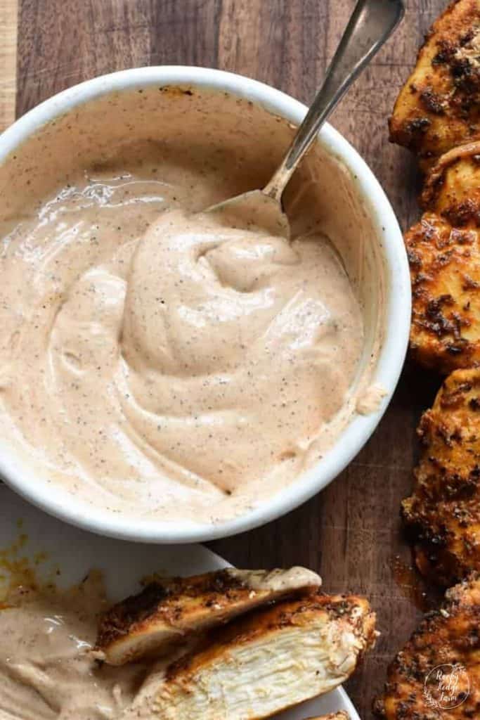 A white bowl filled with homemade blackened chicken sauce