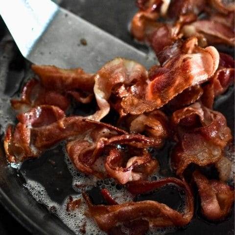 Cooked bacon in a cast iron skillet