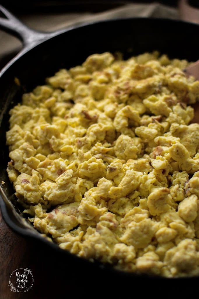 scrambled eggs in a cast iron skillet