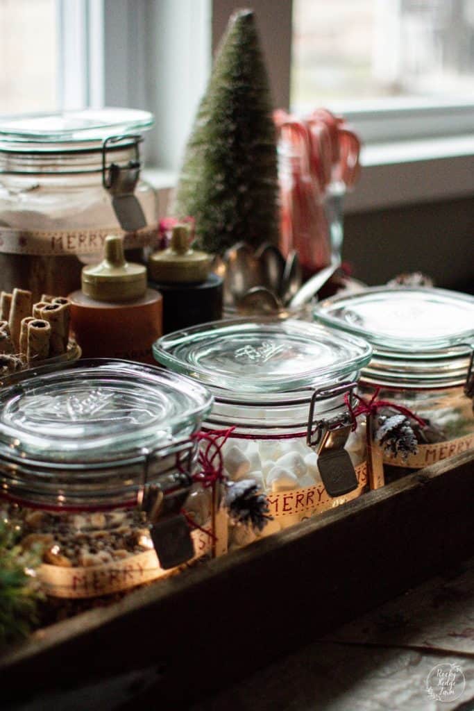 Three jars filled with toppings for a hot chocolate bar