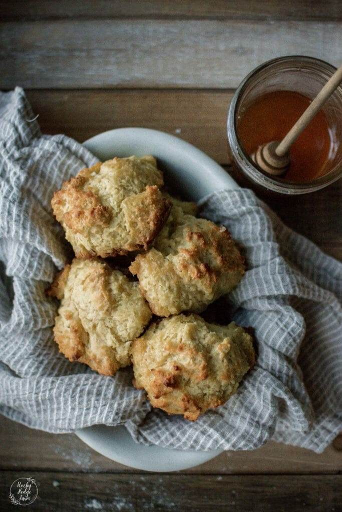 Hot biscuits with a jar of honey