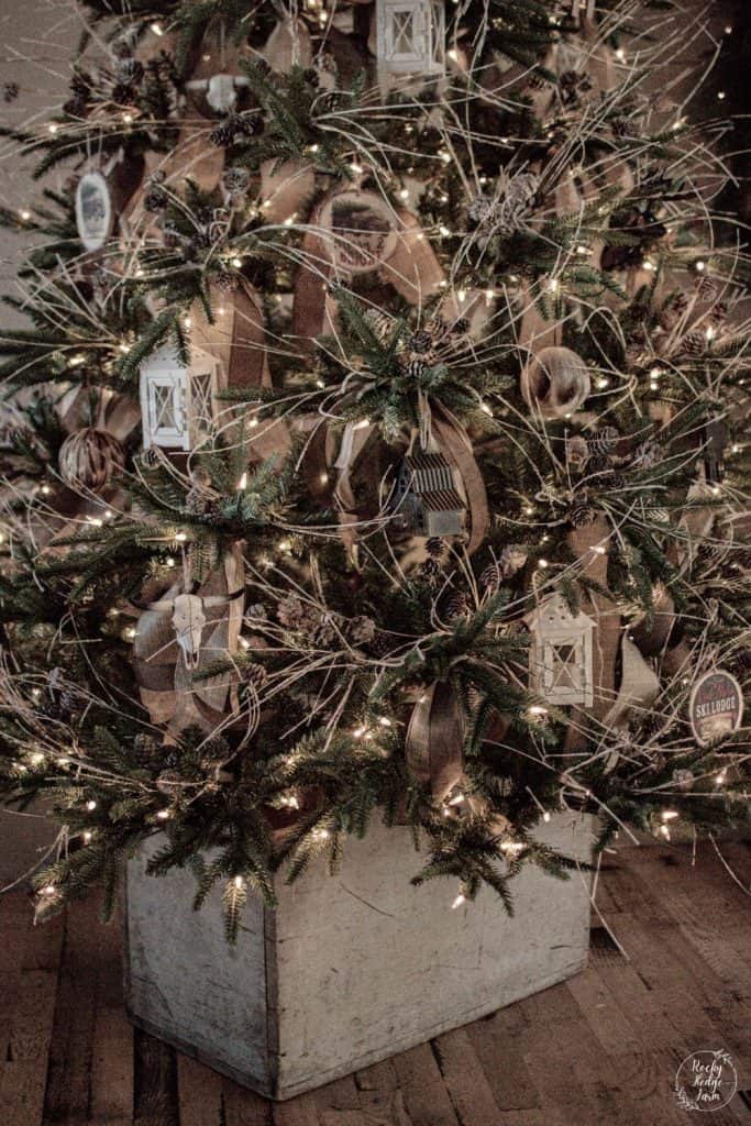 Christmas tree in a box with rustic woodland ornaments