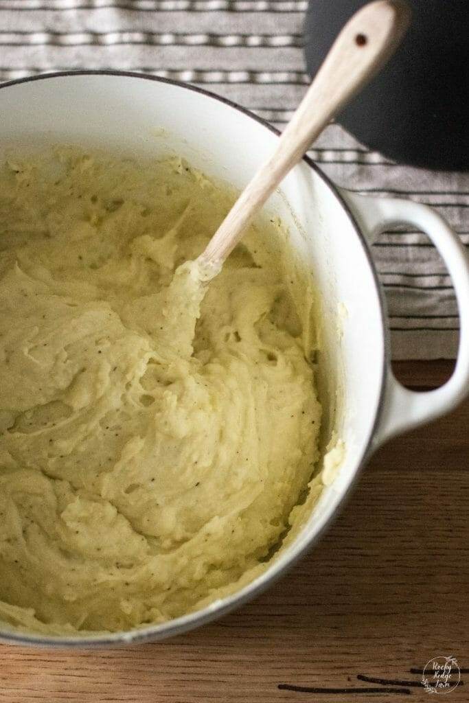 Loaded mashed potatoes in a dutch oven