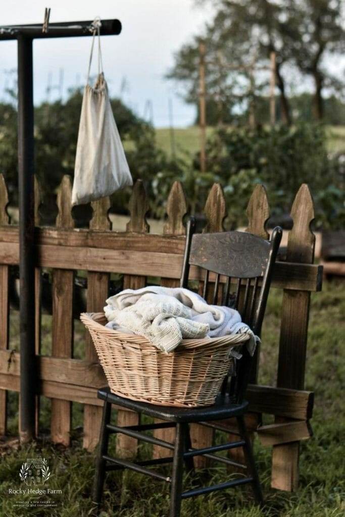 A wicker basket filled with line dried laundry