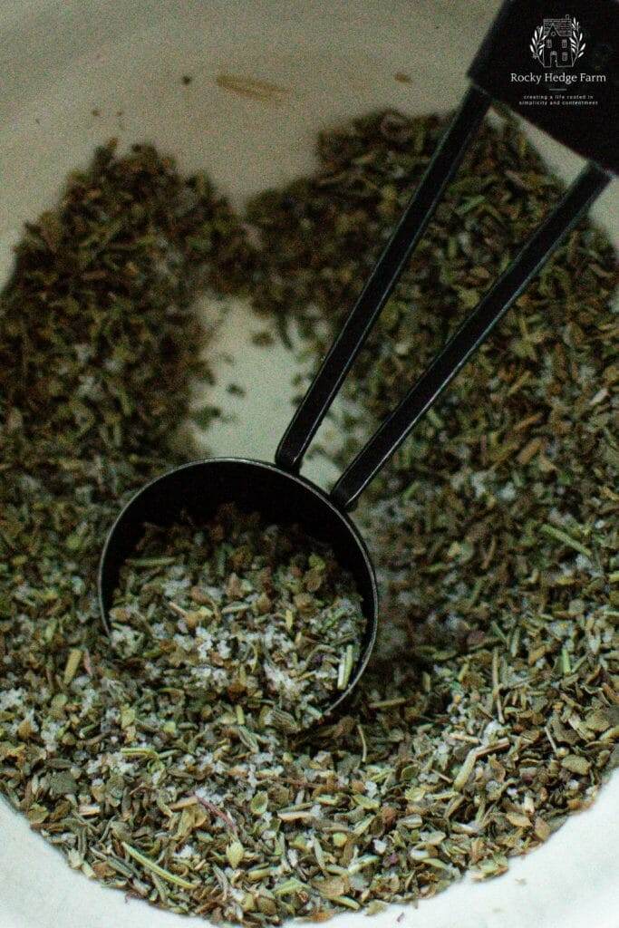 a bowl with herbs for roasted potatoes