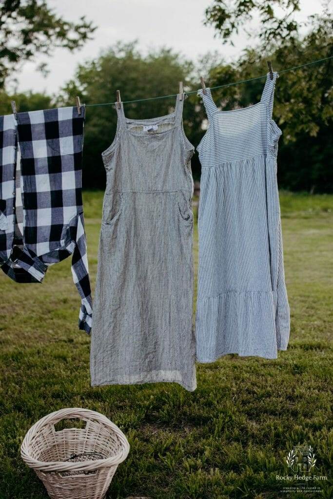 Dresses gracefully swaying in the wind on the clothesline.