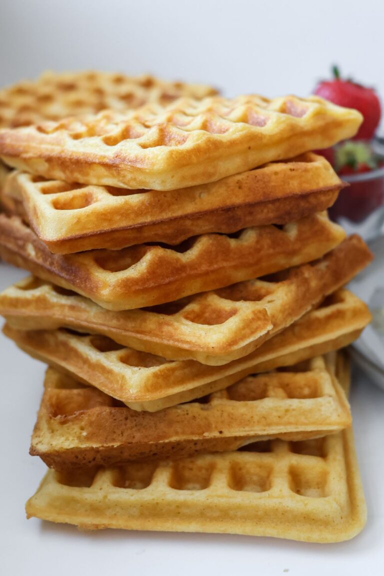 a large stack of homemade waffles