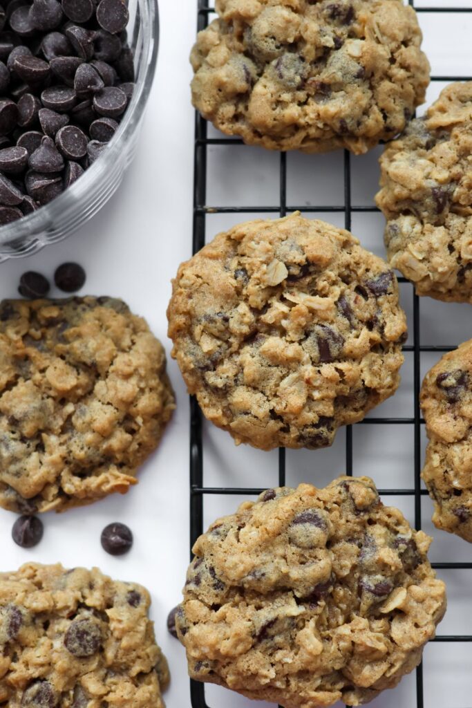 freshly baked oatmeal chocolate chip cookies with a golden-brown texture and melted chocolate chips.