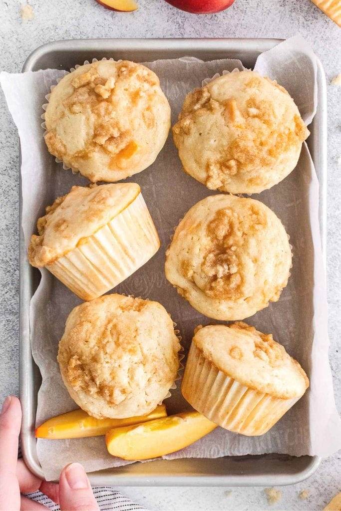 6 peach muffins on a pan