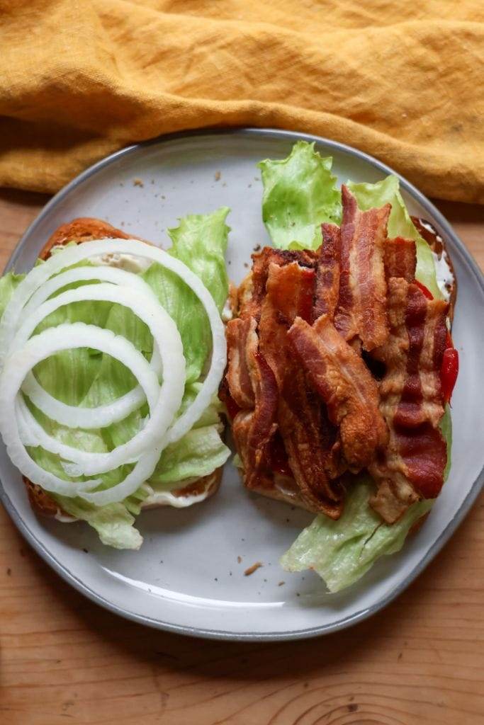 lettuce tomato onion and mayo with bacon on toasted bread for blt