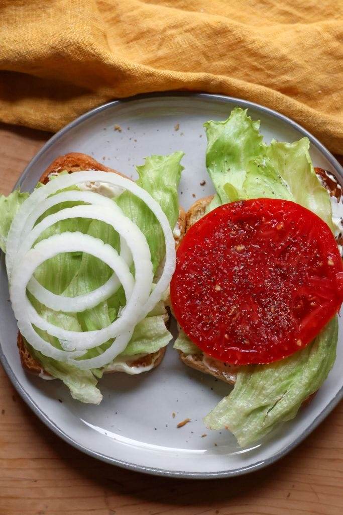 Onion and Lettuce and tomato on toasted bread for a BLT