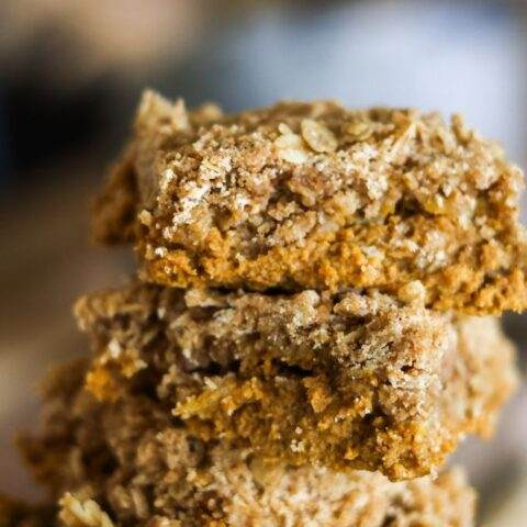 a stack of pumpkin crisp bars with oats