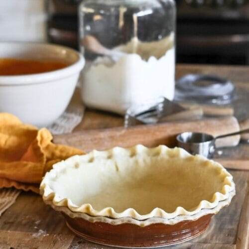 crimped pie dough in a pie plate