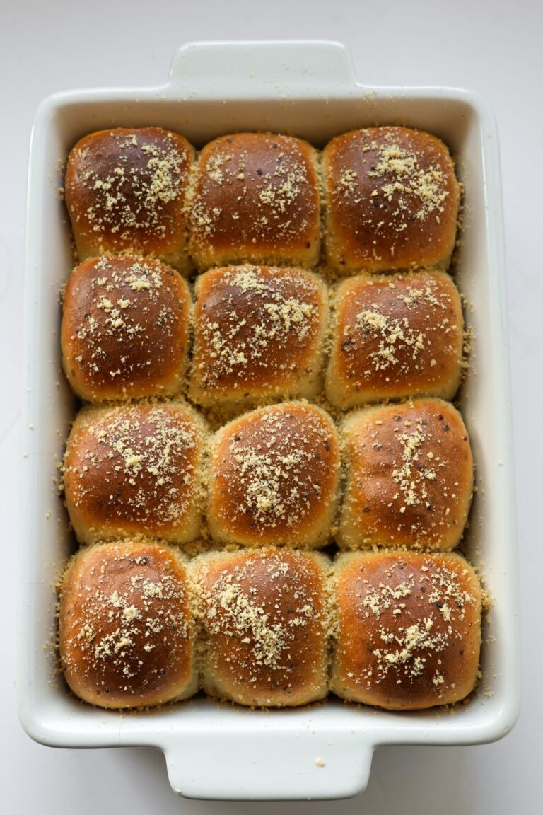 Overhead shot of rosemary garlic dinner rolls with a crispy golden crust