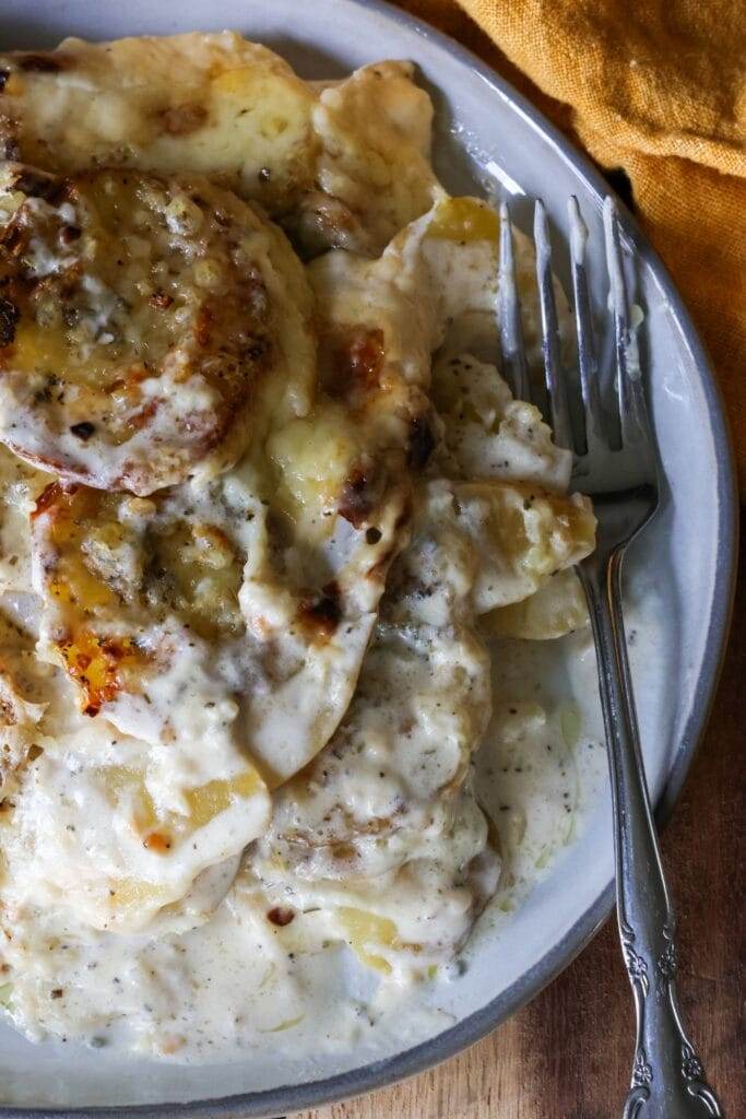 Golden and creamy scalloped potatoes topped with melted Gruyère cheese