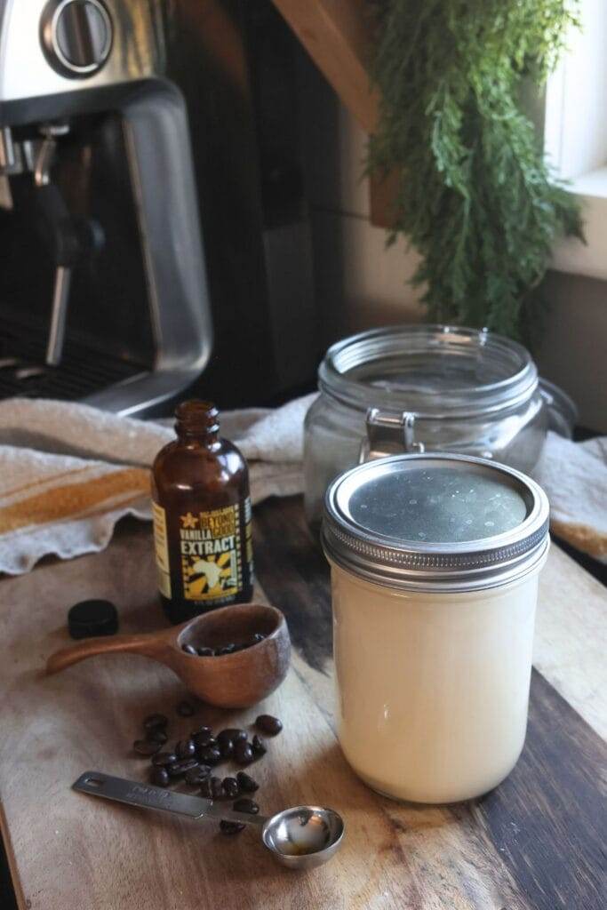 Storing homemade vanilla maple coffee creamer in an airtight mason jar in the refrigerator for freshness.