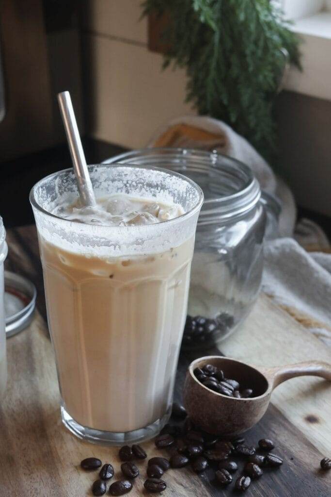 Iced coffee topped with homemade vanilla maple coffee creamer for a creamy, refreshing drink.