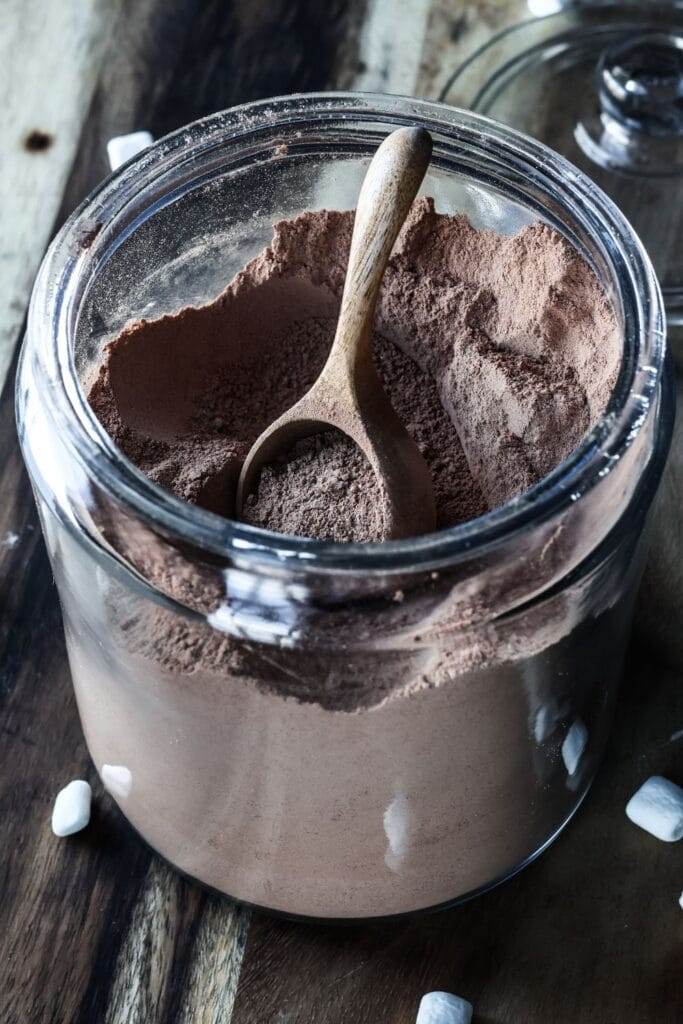 Homemade hot cocoa mix in a large jar.