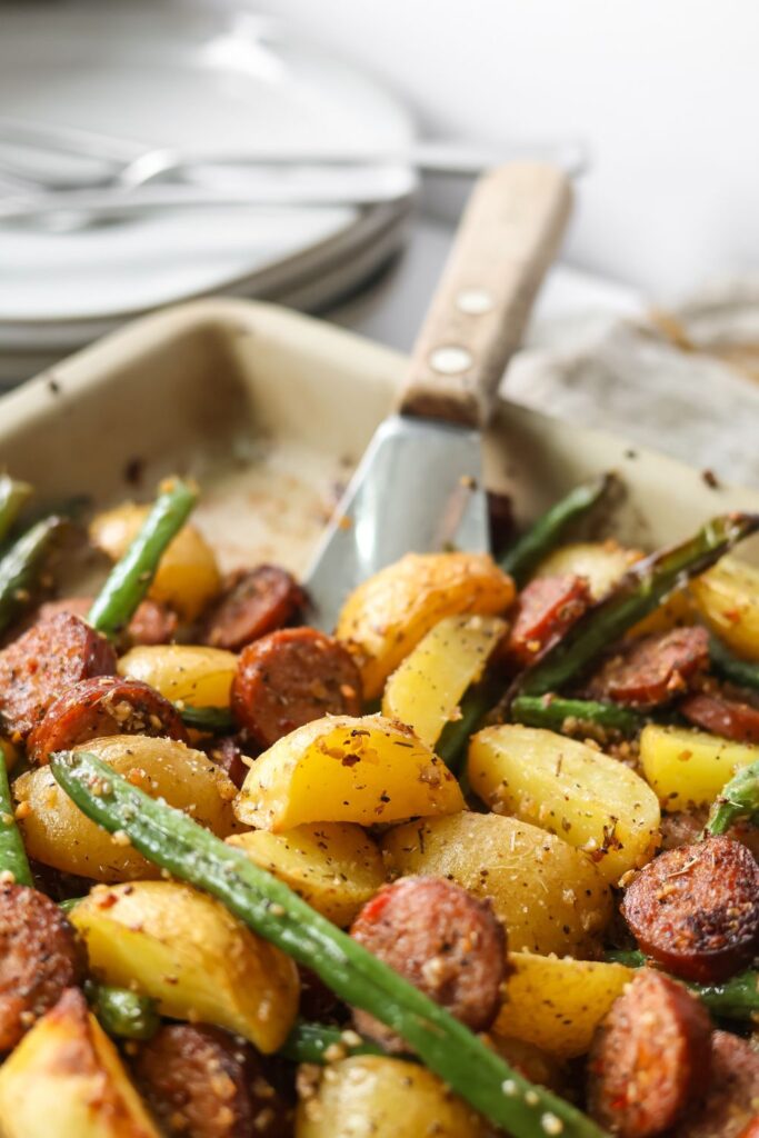 Easy sheet pan dinner with smoked sausage, crispy potatoes, and fresh green beans