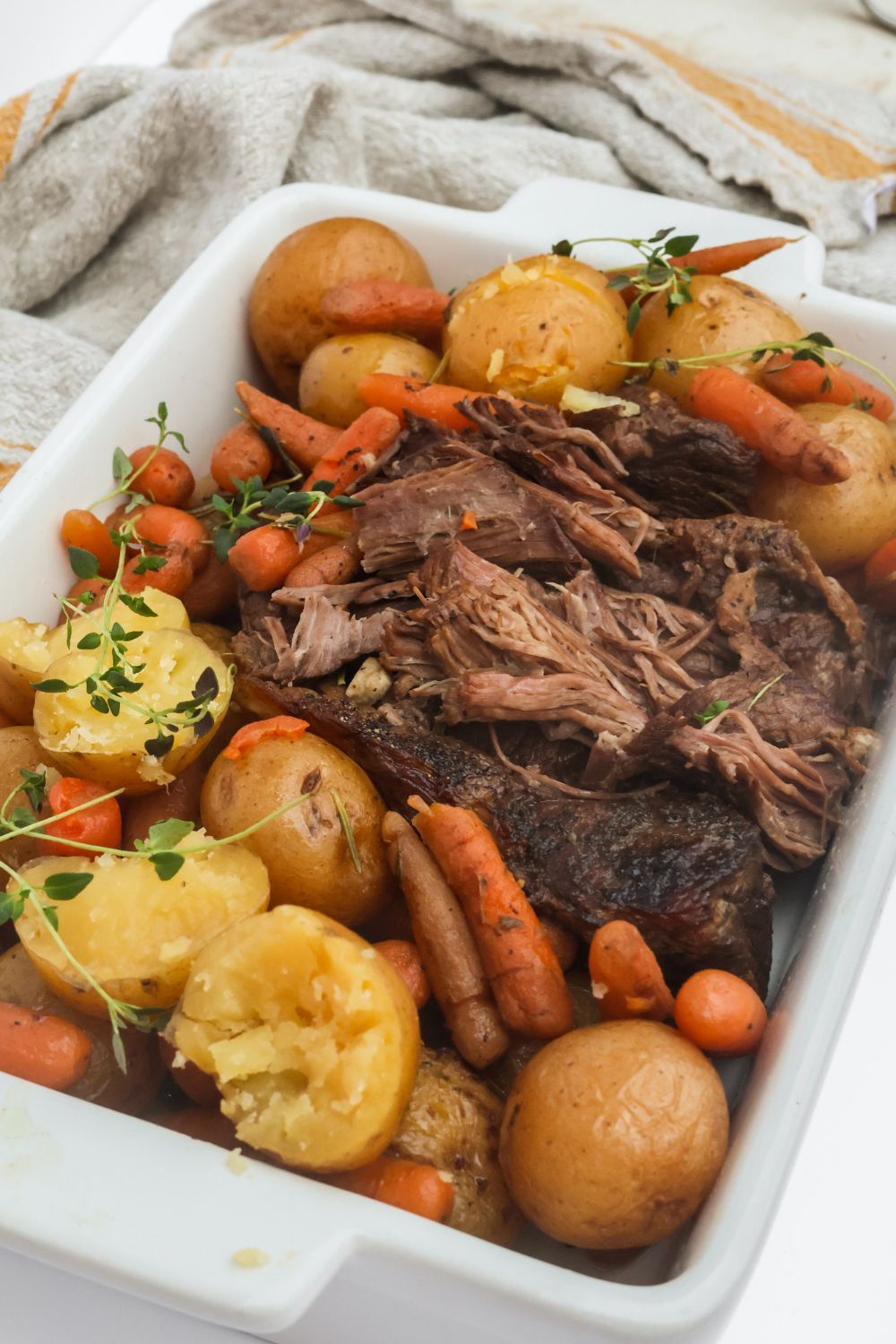 Shredded pot roast served with tender potatoes and carrots