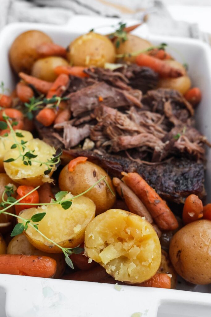 Hearty and comforting shredded pot roast served with vegetables, ready to enjoy.