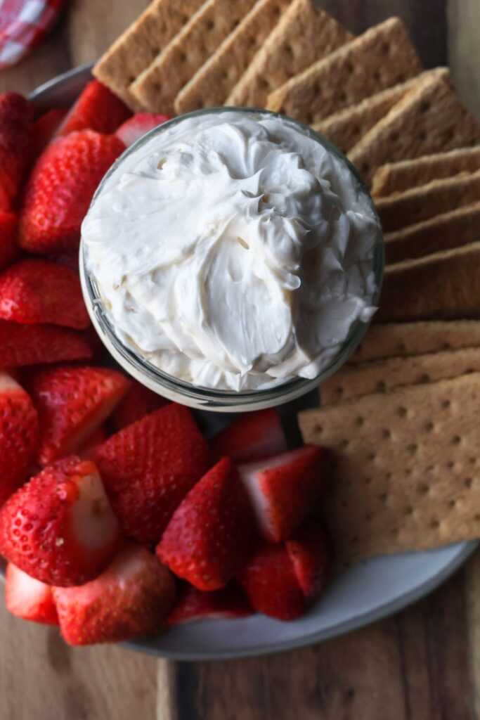 an upclose photo of cheesecake dip for strawberries