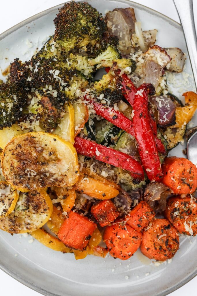 white plate filled with delicious roasted veggies from the oven